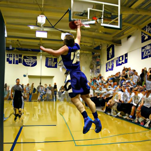 The crowd erupts as a Hillsdale Men's Basketball player executes a jaw-dropping slam dunk.