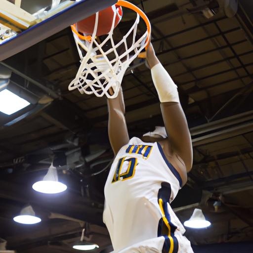 The crowd roars as a TCNJ Men's Basketball player soars through the air for a powerful slam dunk.