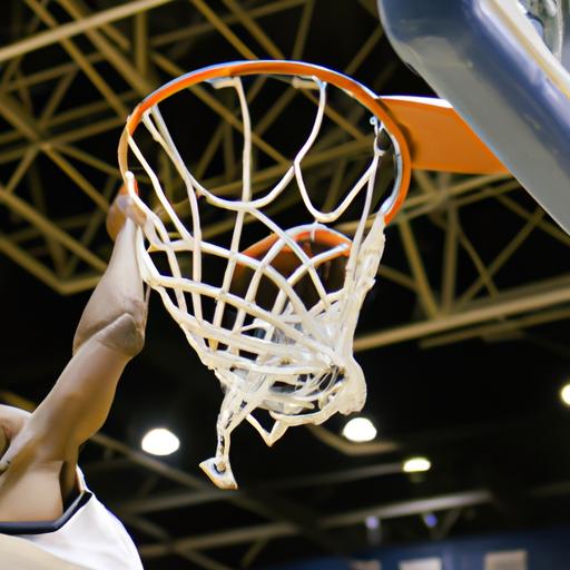Wingate men's basketball player wows the crowd with an incredible slam dunk, showcasing his athleticism.